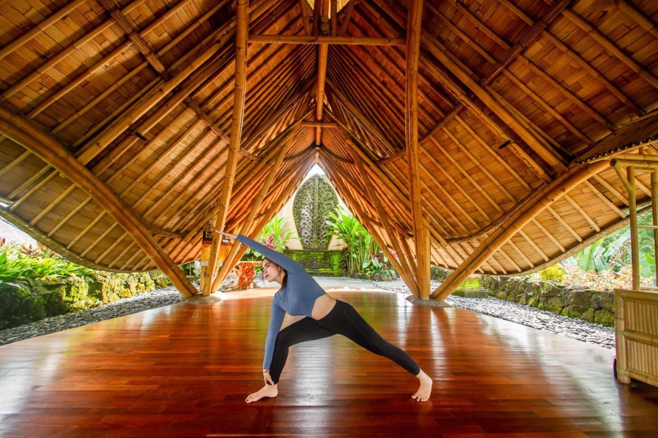 Weda Cita Resort And Spa By Mahaputra Ubud Kültér fotó A woman practicing yoga at the Four Seasons Resort Maui